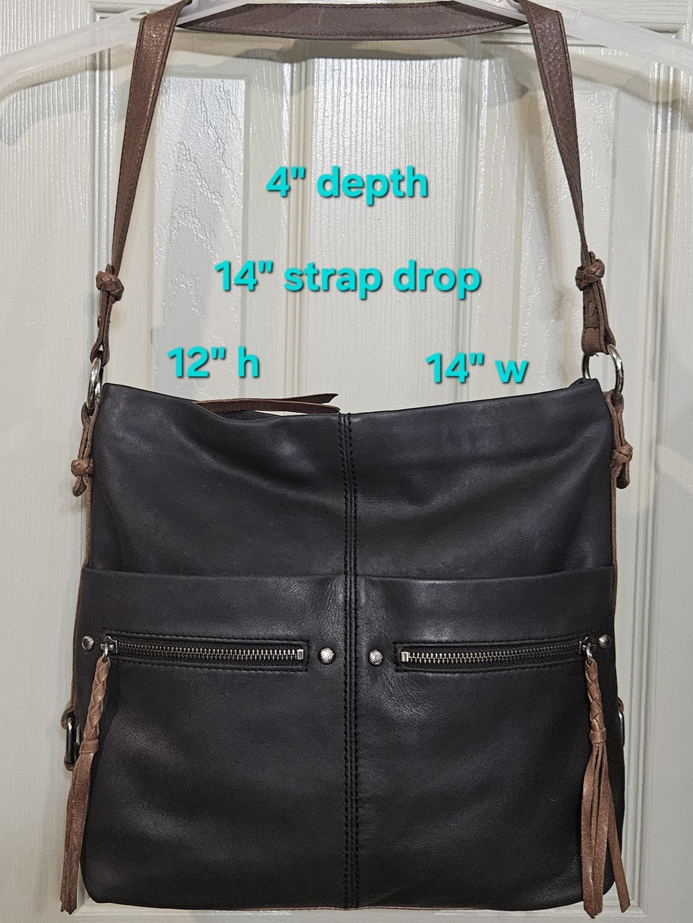 The SAK Ashland Black Leather Bucket Bag With Mushroom Color Leather Strap